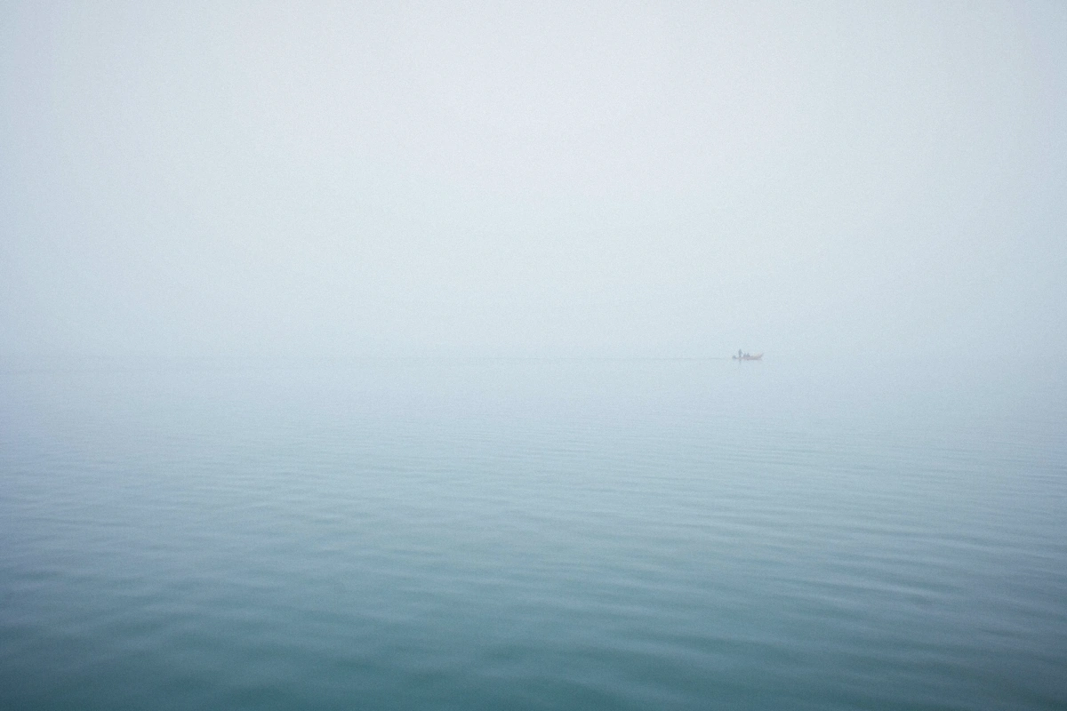 Private motorboat crossing the open Venetian lagoon toward Burano on a private Murano Burano tour with hotel pickup