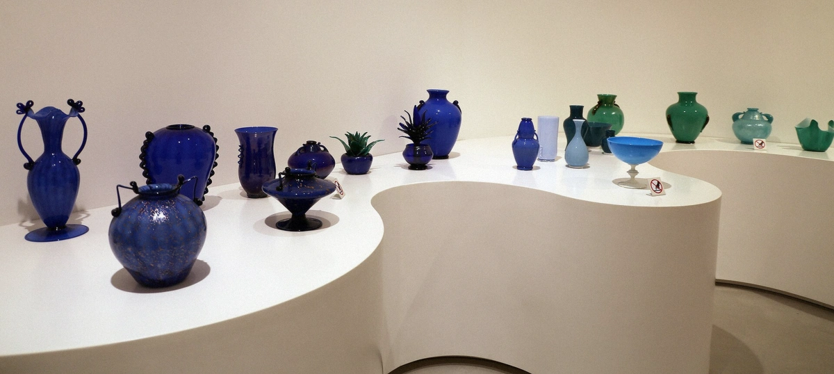 Historic Murano glass pieces displayed in the Glass Museum at Palazzo Giustinian, the deep-history stop on the glass island
