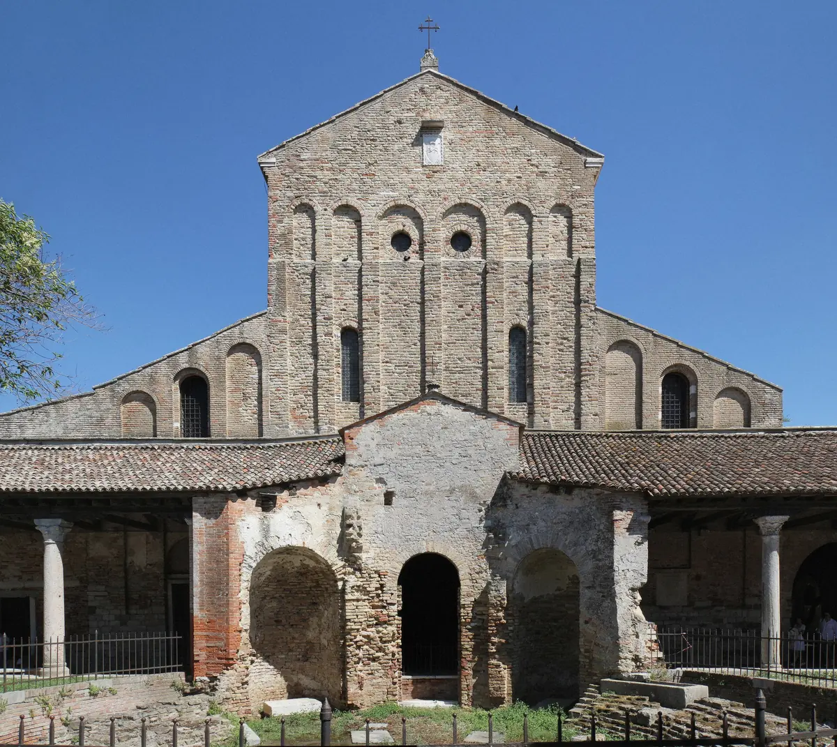 The basilica on quiet Torcello island across its meadow, the stop only the private charter and the six-hour day include