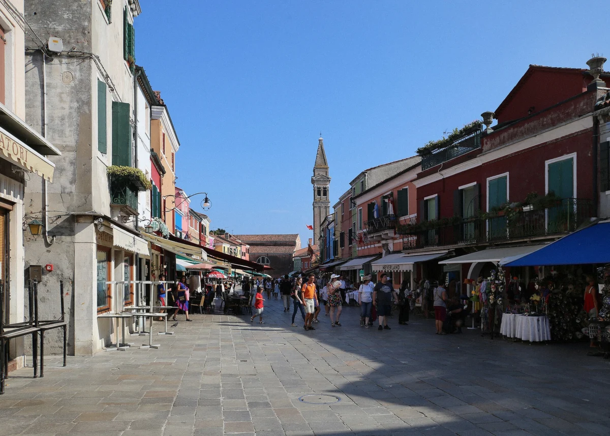 Via Galuppi, Burano's main street of painted houses, walked with the guide on the Murano and Burano guided tour